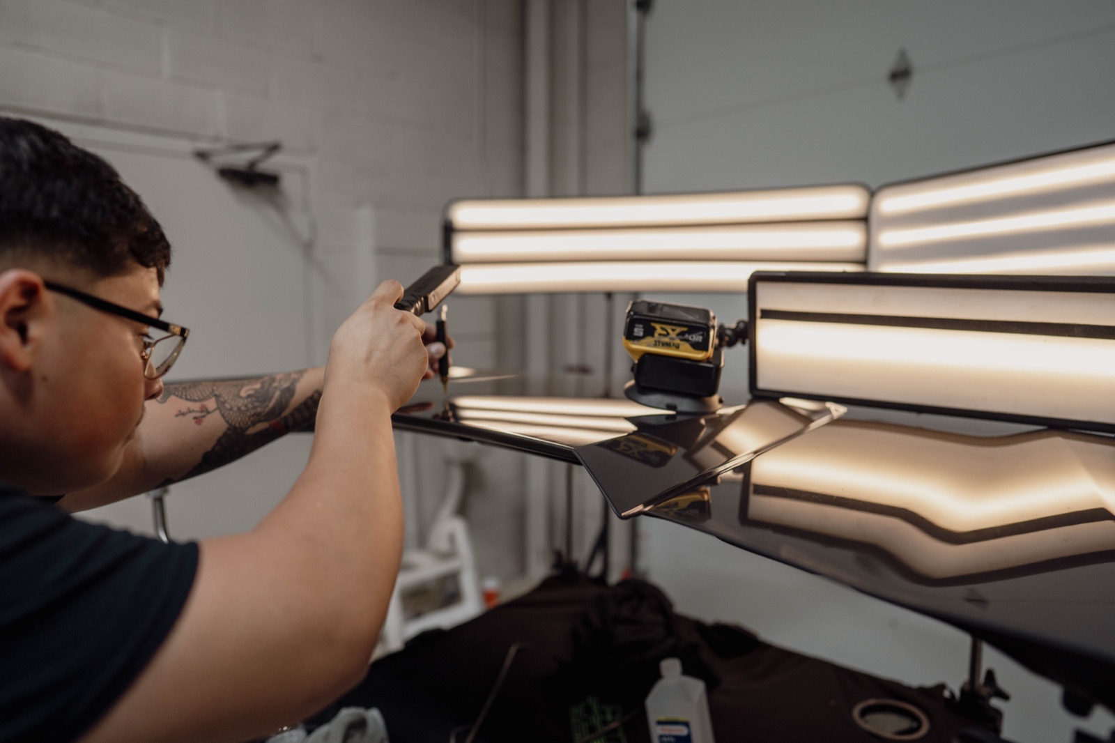 Repaired panel with factory-finish mirror reflection under PDR reading lights
